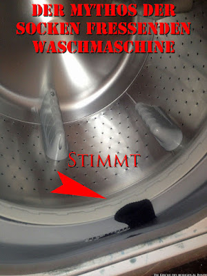 Mythos Socken fressende Waschmaschine mit Text
