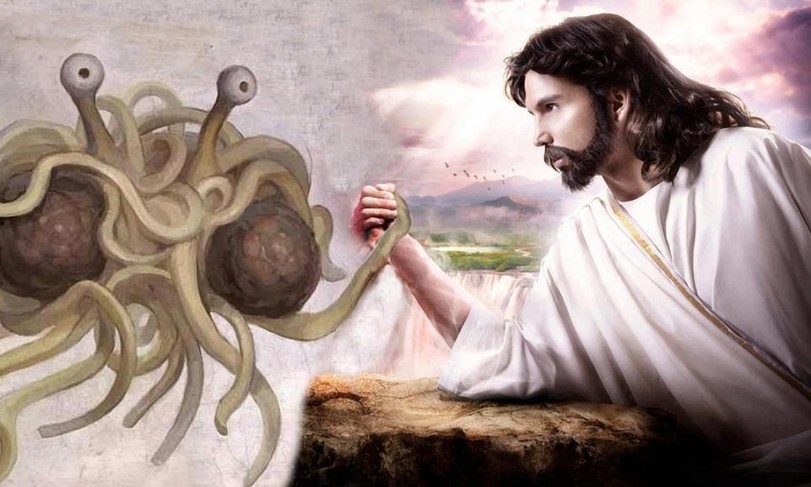 Religionsparodie KdFSM Spaghetti Monster gegen Jesus beim Armdrücken
